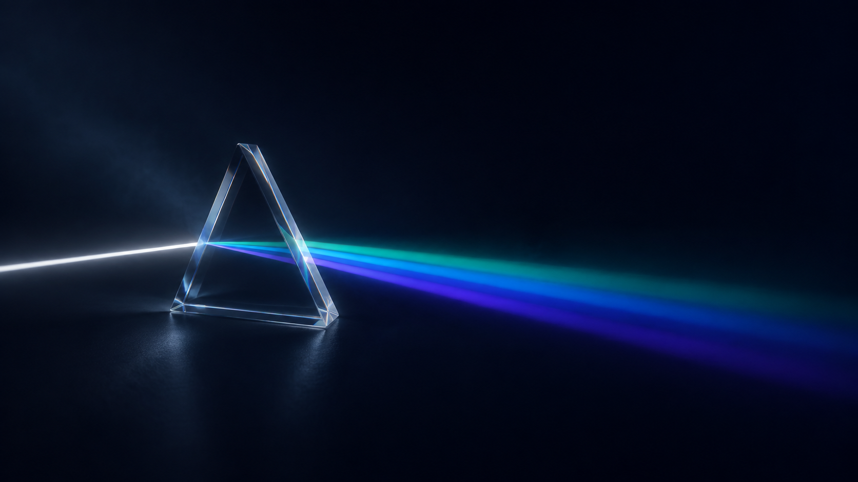 White light refracting through a glass prism into teal, azure and indigo
